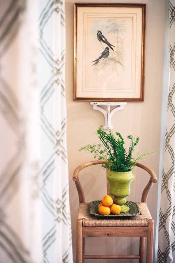 A simple potted fern and a few lemons are an elegant grouping that echoes a turn-of the-century still-life painting.