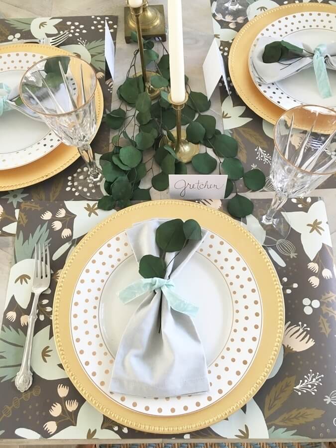 Using a roll of wrapping paper instead of a pricey table covering gives modern, festive flair to this dinner party tablescape.