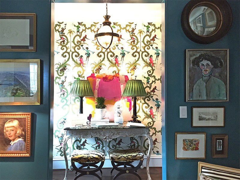 Teal walls and whimsical monkey wallpaper in hall at Home for Holidays showhouse 2015