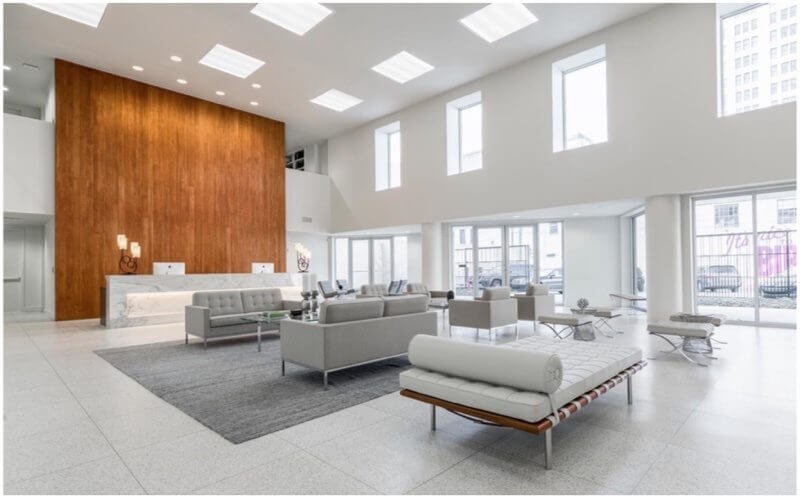 This main two-story lobby space serves as the client entry and will act as the largest gathering space with a large accent wall on the west end of the space that presentations can be projected onto Image Lewis Communications