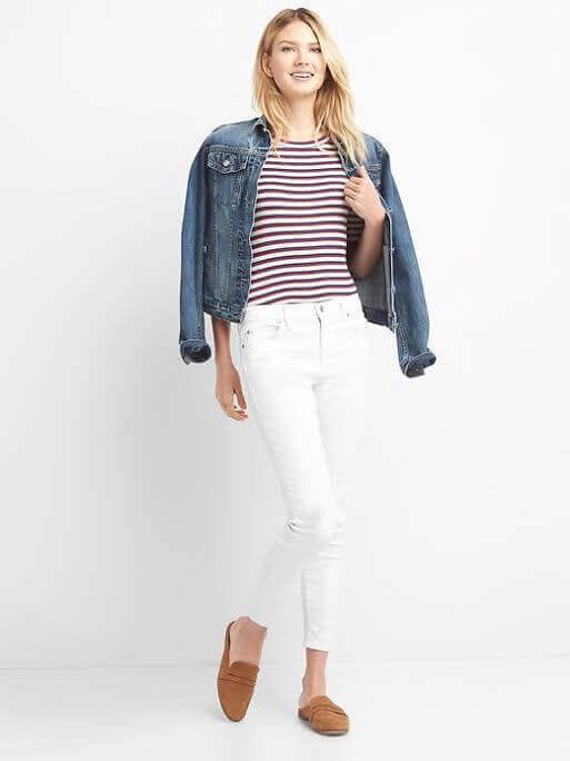 A three-quarter-length vibrant top with a classic third piece makes this white jean ensemble collected and polished. Image: Gap