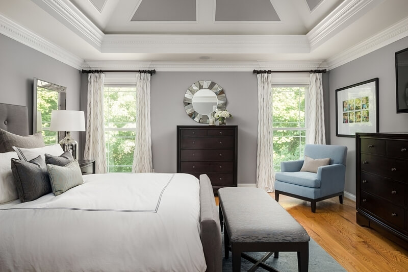 Serene grays and soothing blues set the tone for relaxation and restoration in this bedroom retreat. 