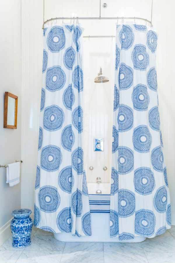 Blue and white shower curtain in the bathroom