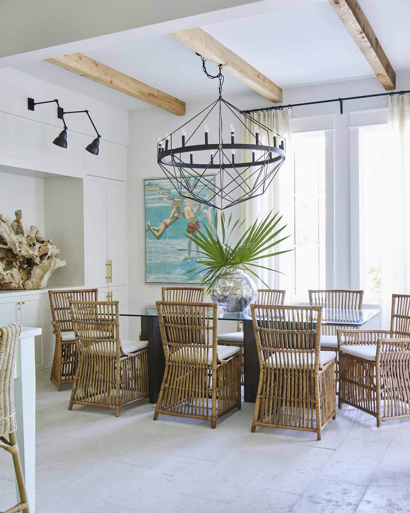Dining room with rattan chairs in Rosemary Beach house