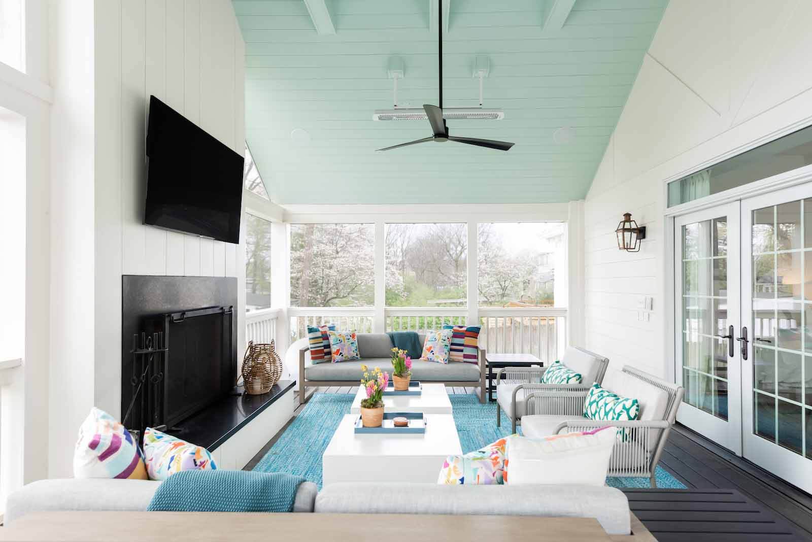 Screened porch with teal ceiling by Merrill Construction Group